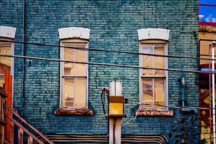 windows on blue brick